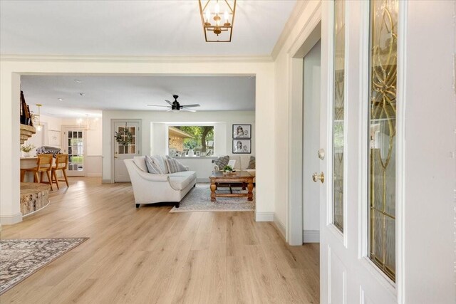 3220 Patricia Ln, Pearland, TX 77581 - living area with light wood-type flooring, a chandelier, and a ceiling fan