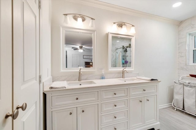3220 Patricia Ln, Pearland, TX 77581 - bathroom with ornamental molding, double vanity, a shower, wood finished floors, and ceiling fan
