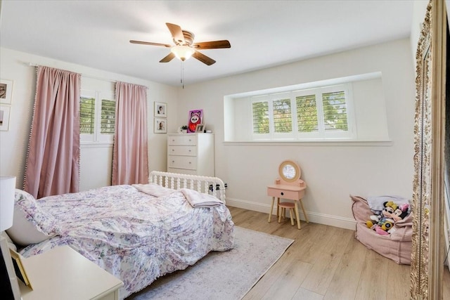 3220 Patricia Ln, Pearland, TX 77581 - bedroom featuring multiple windows, wood finished floors, and a ceiling fan