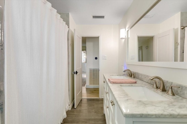 3220 Patricia Ln, Pearland, TX 77581 - full bath with wood finished floors and double vanity