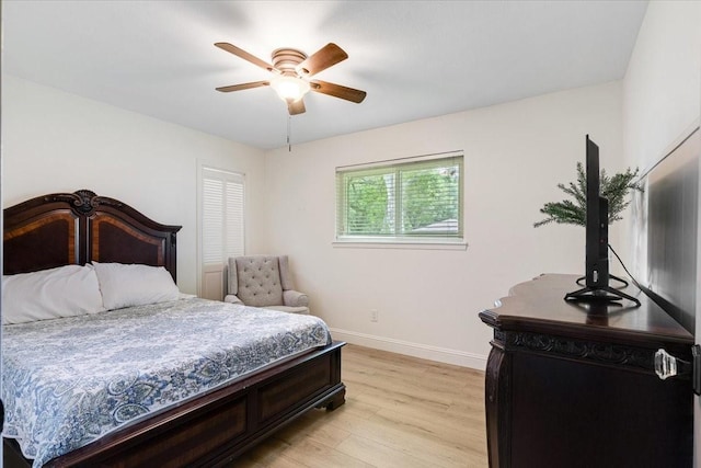 3220 Patricia Ln, Pearland, TX 77581 - bedroom with light wood finished floors and a ceiling fan