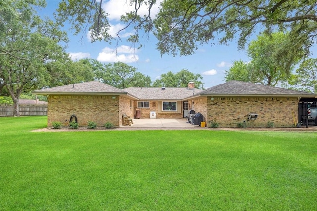 3220 Patricia Ln, Pearland, TX 77581 - back of property featuring a patio area, a chimney, and brick siding