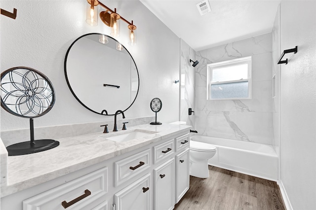 28207 Nancy Ln, Conroe, TX 77385 - bathroom featuring vanity, washtub / shower combination, and wood finished floors