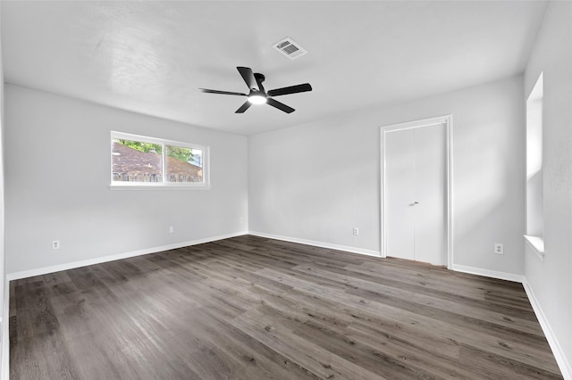 28207 Nancy Ln, Conroe, TX 77385 - unfurnished bedroom featuring dark wood-type flooring and ceiling fan