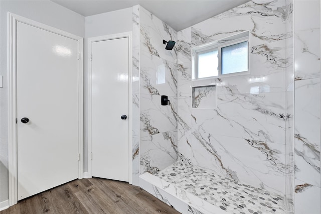 28207 Nancy Ln, Conroe, TX 77385 - bathroom featuring a marble finish shower and wood finished floors