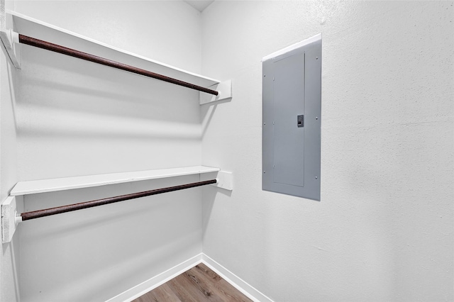 28207 Nancy Ln, Conroe, TX 77385 - walk in closet featuring electric panel and dark wood finished floors