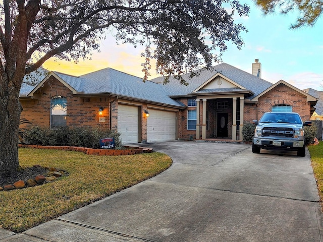 20710 Wagon Bridge Ln, Cypress, TX 77433 - view of front facade with brick siding, a garage, a shingled roof, and a chimney