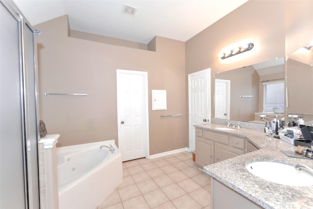 20710 Wagon Bridge Ln, Cypress, TX 77433 - bathroom featuring double vanity, a whirlpool tub, and tile patterned flooring