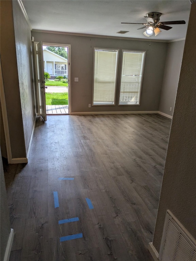 21402 Berry Ridge Ln, Tomball, TX 77375 - empty room featuring wood finished floors, crown molding, and a ceiling fan