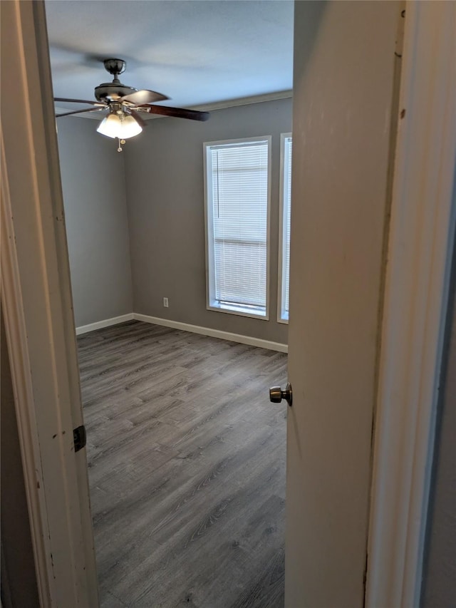21402 Berry Ridge Ln, Tomball, TX 77375 - spare room with a ceiling fan and wood finished floors