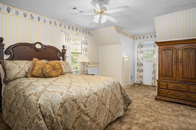 215 Enchanted Estates Dr, Crockett, TX 75835 - bedroom with carpet flooring, wallpapered walls, a textured ceiling, and ceiling fan