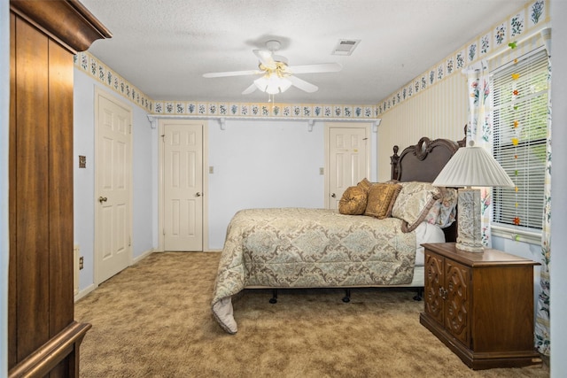 215 Enchanted Estates Dr, Crockett, TX 75835 - bedroom featuring carpet floors, a ceiling fan, and a textured ceiling