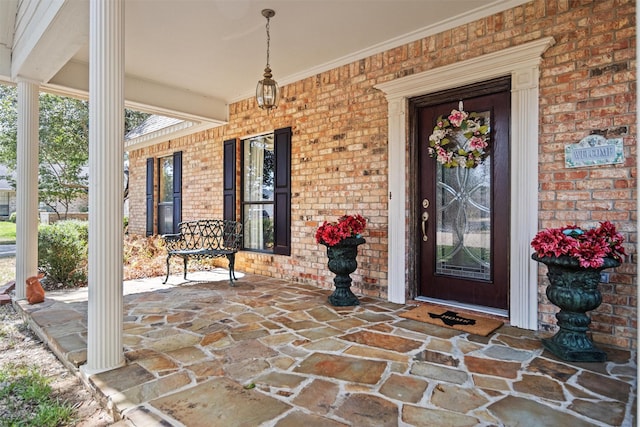 215 Enchanted Estates Dr, Crockett, TX 75835 - entrance to property featuring a porch and brick siding