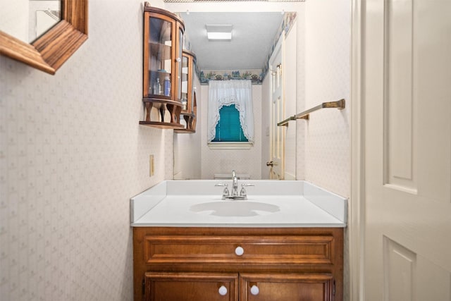 215 Enchanted Estates Dr, Crockett, TX 75835 - bathroom with wallpapered walls and vanity