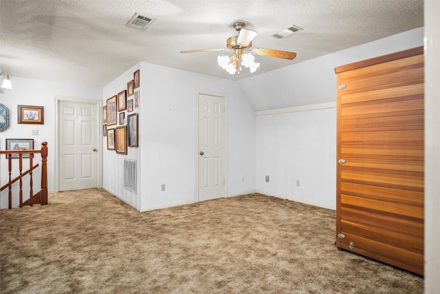 215 Enchanted Estates Dr, Crockett, TX 75835 - bonus room featuring carpet, a ceiling fan, and a textured ceiling