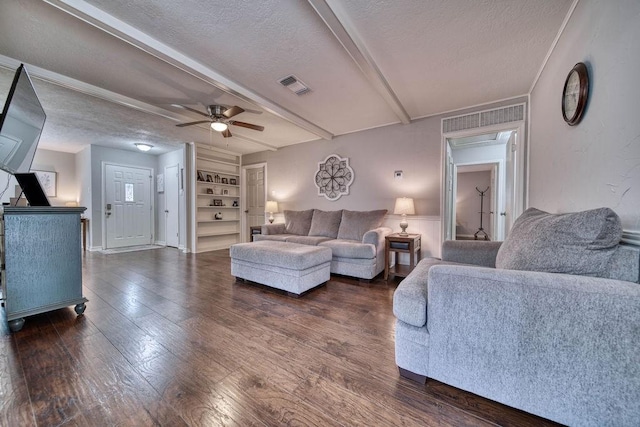 16223 White Star Dr, Houston, TX 77062 - living area featuring a textured ceiling, ceiling fan, dark wood finished floors, and beamed ceiling