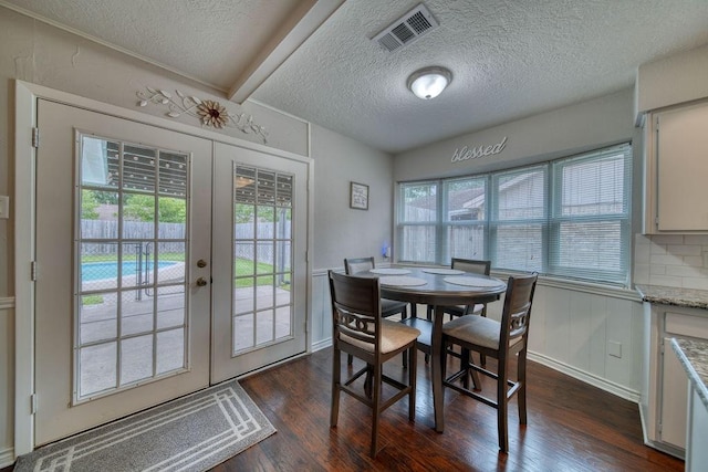 16223 White Star Dr, Houston, TX 77062 - dining area with french doors, dark wood-type flooring, and a textured ceiling