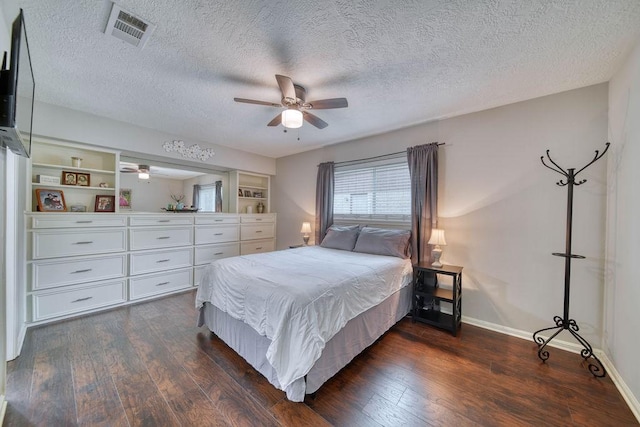 16223 White Star Dr, Houston, TX 77062 - bedroom featuring dark wood finished floors, a textured ceiling, and ceiling fan