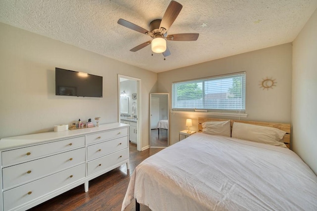 16223 White Star Dr, Houston, TX 77062 - bedroom with a textured ceiling, dark wood finished floors, ensuite bath, and ceiling fan