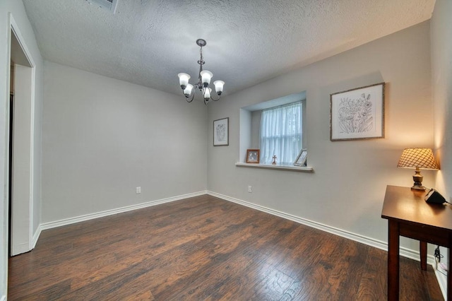 16223 White Star Dr, Houston, TX 77062 - spare room with a chandelier, dark wood-type flooring, and a textured ceiling