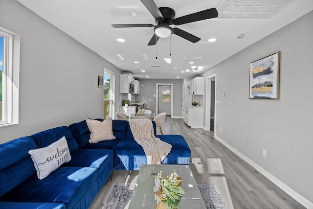 6810 Cohn St, Houston, TX 77091 - living room featuring light wood-type flooring, ceiling fan, and recessed lighting
