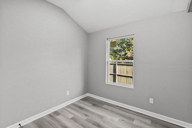 6810 Cohn St, Houston, TX 77091 - empty room featuring lofted ceiling and wood finished floors