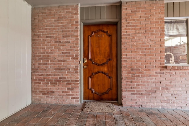 6437 Bayou Glen Rd, Houston, TX 77057 - doorway to property with brick siding and board and batten siding