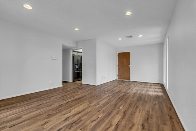 6437 Bayou Glen Rd, Houston, TX 77057 - empty room featuring wood finished floors and recessed lighting
