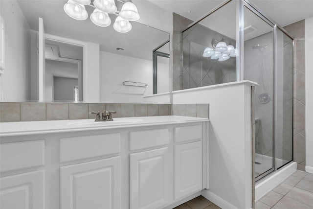 6437 Bayou Glen Rd, Houston, TX 77057 - bathroom with tile patterned flooring, a shower stall, and vanity
