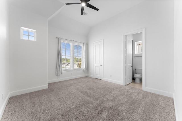1038 E 29th St, Houston, TX 77009 - unfurnished bedroom featuring multiple windows, carpet, vaulted ceiling, ensuite bathroom, and ceiling fan