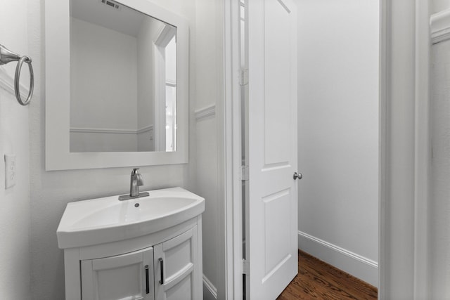1038 E 29th St, Houston, TX 77009 - bathroom featuring wood finished floors and vanity