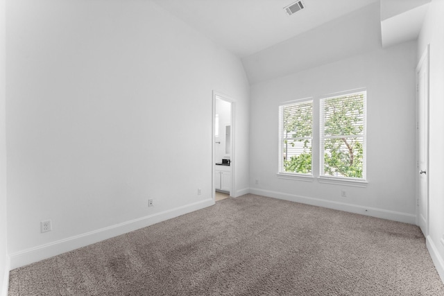 1038 E 29th St, Houston, TX 77009 - unfurnished room featuring light colored carpet and vaulted ceiling