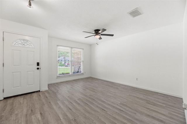 12211 Pine Knoll Dr, Houston, TX 77099 - foyer entrance featuring a ceiling fan and light wood-style floors