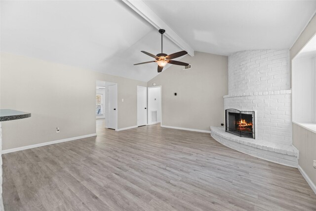 12211 Pine Knoll Dr, Houston, TX 77099 - unfurnished living room with a fireplace, ceiling fan, and wood finished floors