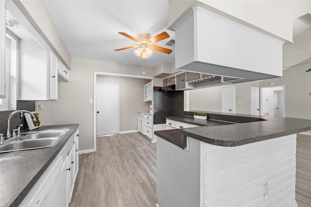 12211 Pine Knoll Dr, Houston, TX 77099 - kitchen featuring ceiling fan, dishwasher, dark countertops, a peninsula, and light wood-style floors