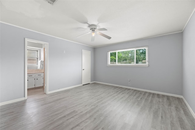12211 Pine Knoll Dr, Houston, TX 77099 - spare room featuring ceiling fan, light wood-style floors, and crown molding