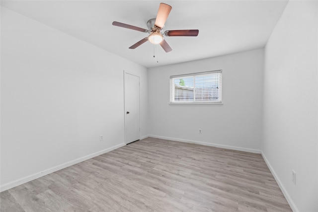 12211 Pine Knoll Dr, Houston, TX 77099 - spare room with light wood finished floors and a ceiling fan