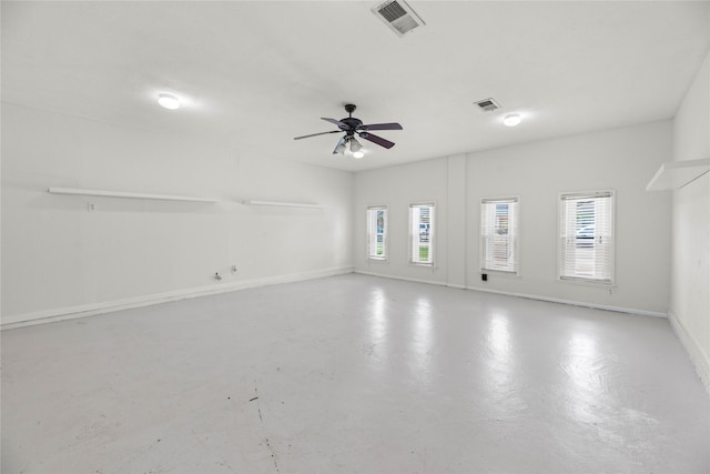 12211 Pine Knoll Dr, Houston, TX 77099 - unfurnished room with plenty of natural light, finished concrete flooring, and a ceiling fan