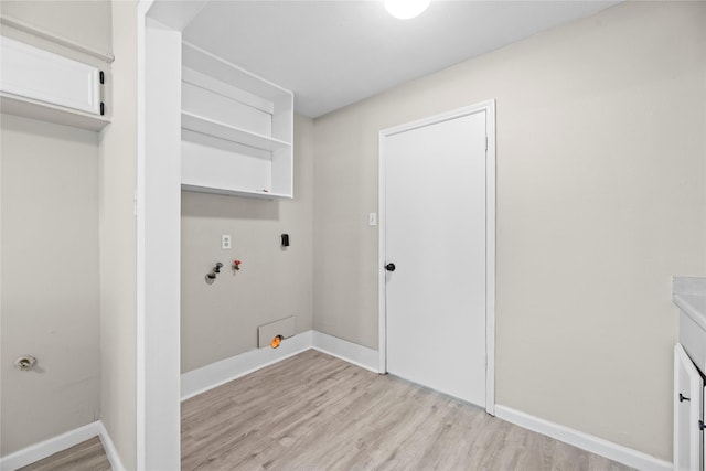 12211 Pine Knoll Dr, Houston, TX 77099 - washroom with light wood finished floors, washer hookup, and hookup for a gas dryer