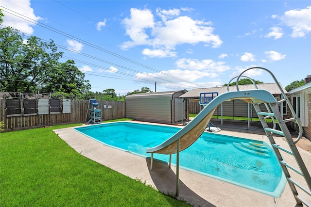12211 Pine Knoll Dr, Houston, TX 77099 - view of swimming pool with a fenced backyard and a shed