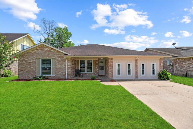 12211 Pine Knoll Dr, Houston, TX 77099 - view of front of house featuring board and batten siding, a front yard, and brick siding