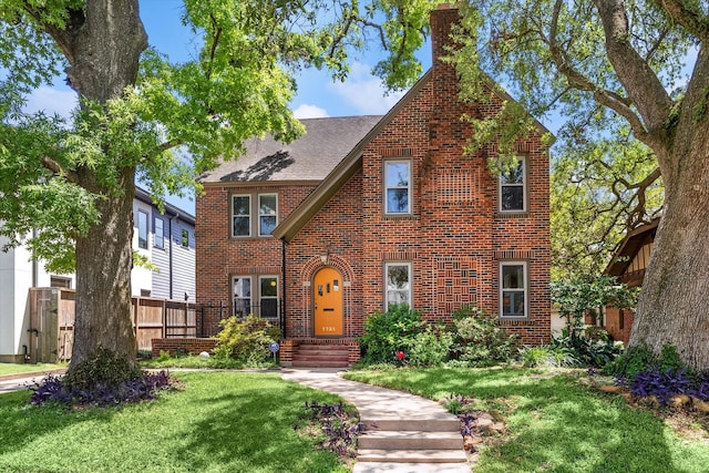 1731 Marshall St, Houston, TX 77098 - english style home featuring brick siding, a chimney, and roof with shingles