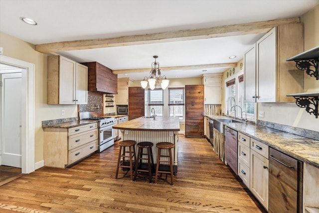 1731 Marshall St, Houston, TX 77098 - kitchen with stainless steel appliances, dark wood finished floors, plenty of natural light, beam ceiling, and butcher block countertops
