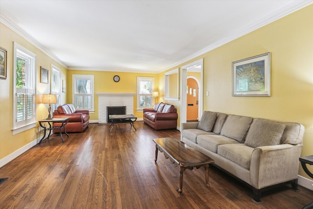 1731 Marshall St, Houston, TX 77098 - living room featuring dark wood finished floors, arched walkways, crown molding, and a brick fireplace