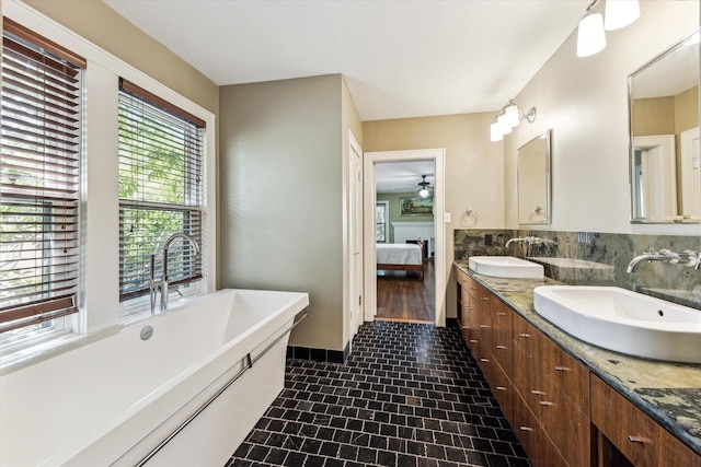 1731 Marshall St, Houston, TX 77098 - bathroom featuring double vanity, a soaking tub, ensuite bathroom, and a ceiling fan