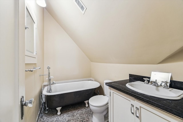 1731 Marshall St, Houston, TX 77098 - full bath with a freestanding bath, vaulted ceiling, vanity, and tile patterned flooring