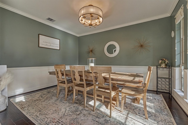 20210 Mariposa Blue Ln, Cypress, TX 77433 - dining space with a chandelier, ornamental molding, wood finished floors, and a wainscoted wall
