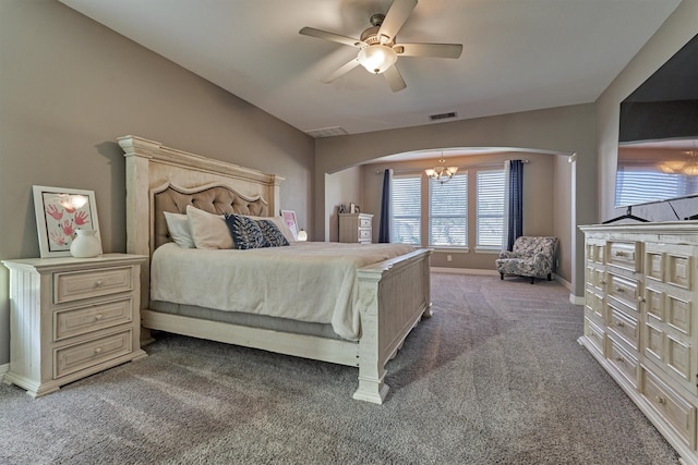 20210 Mariposa Blue Ln, Cypress, TX 77433 - bedroom featuring arched walkways, carpet, ceiling fan, and a chandelier