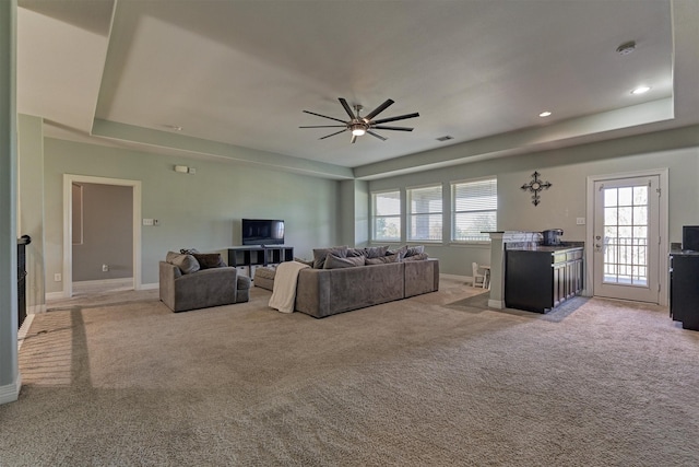 20210 Mariposa Blue Ln, Cypress, TX 77433 - living area with light colored carpet, a ceiling fan, a raised ceiling, and recessed lighting