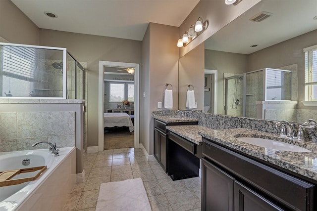 20210 Mariposa Blue Ln, Cypress, TX 77433 - full bath featuring a shower stall, vanity, a garden tub, ensuite bath, and tile patterned floors